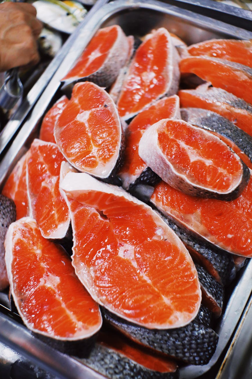 fresh salmon steaks placed in store